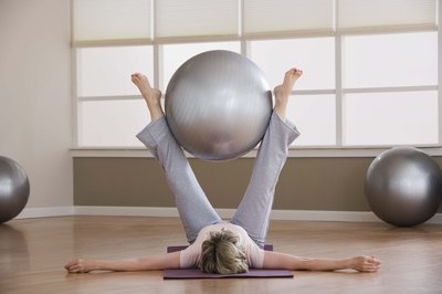 Jupiterimages/Comstock/Getty Images Liven up your hip workout with a physio ball.
