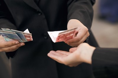 Jupiterimages/liquidlibrary/Getty Images Before you refinance a loan, choose your lender carefully.