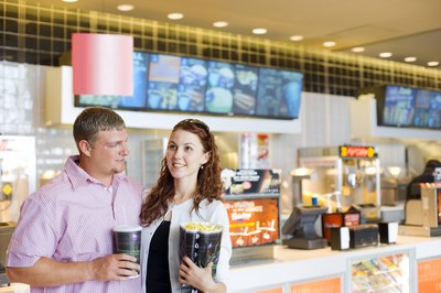 Creatas Images/Creatas/Getty Images Some employers reward employees with free movie tickets.