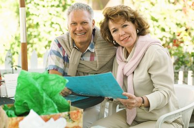 NA/Photos.com/Getty Images Create a financial plan to determine whether you can retire before age 55.