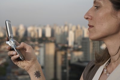 Thomas Northcut/Stockbyte/Getty Images Tattoos are showing up more often in the office.