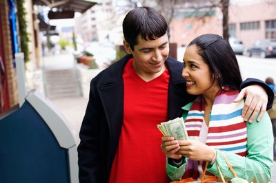 Jupiterimages/Photos.com/Getty Images Making financial decisions together can help you bond.