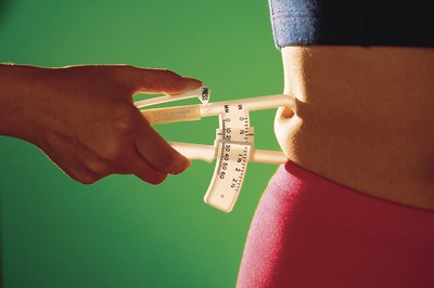 Comstock Images/Comstock/Getty Images Tight jeans aren't the only way to tell when you've gained fat.