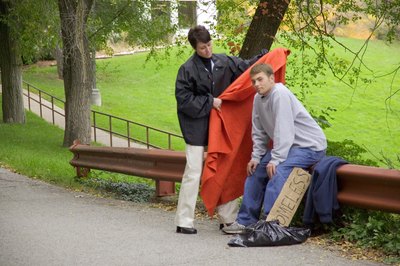 Jupiterimages/liquidlibrary/Getty Images You'll often see people when they're down on their luck.
