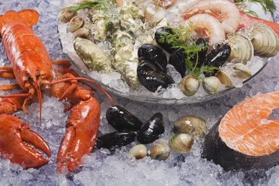 Comstock Images/Comstock/Getty Images Seafood provides dietary vitamin B12, although certain inherited conditions affect B12 absorption and metabolism.