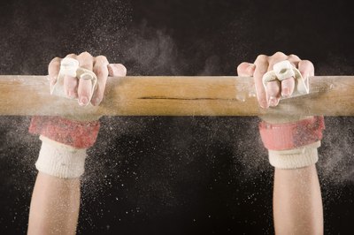 Jupiterimages/BananaStock/Getty Images A layout flyaway is a basic uneven bars dismount.