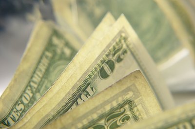 Hemera Technologies/Photos.com/Getty Images Both compound interest and earnings can turn a little money into a lot of cash.