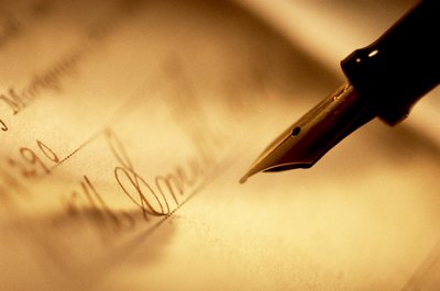 Jupiterimages/liquidlibrary/Getty Images Your spouse may be required to sign refinance documents in community property states.