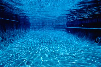 Ryan McVay/Photodisc/Getty Images Solar pool covers can help stop algae growth.