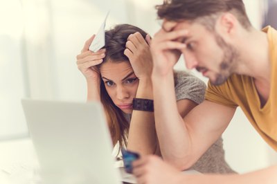 How to Withdraw Money From 403B Mutual Funds to Pay Off Credit Card Debt