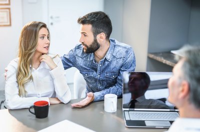 Advantages and Disadvantages of a Joint Bank Account With a Spouse