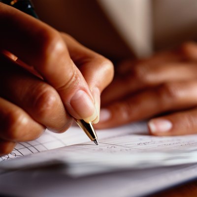 Photodisc/Photodisc/Getty Images Being in the TeleCheck system can hinder your ability to use checks for payment.