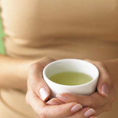 Brand X Pictures/Brand X Pictures/Getty Images Scientists are investigating the therapeutic benefits of green tea extract.