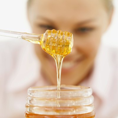 George Doyle/Stockbyte/Getty Images Fructose naturally occurs in honey.