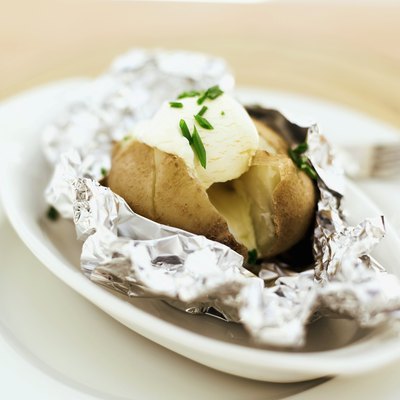 George Doyle/Stockbyte/Getty Images A baked potato with fat-free sour cream and chives is a delicious low-sodium option.