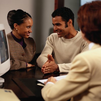 Keith Brofsky/Photodisc/Getty Images Your payment amount determines how your mortgage loan affects your FICO score.