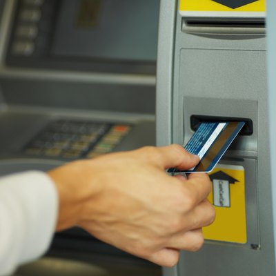 Stockbyte/Stockbyte/Getty Images Millions of Americans use credit cards every day.