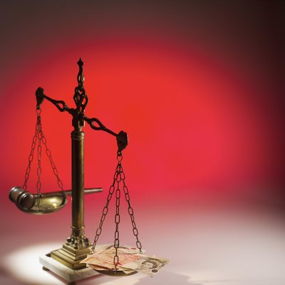 Stockbyte/Stockbyte/Getty Images The amount of money the government can take varies, but it does not require a court decree.