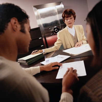 Keith Brofsky/Photodisc/Getty Images Although less common than bank loans, credit union mortgages are a viable option.
