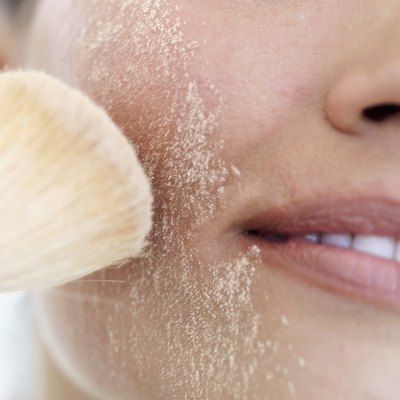 Stockbyte/Stockbyte/Getty Images Powders, creams and concealers are all found in a camouflage cometician's toolbox.