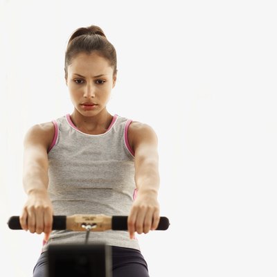 George Doyle/Stockbyte/Getty Images Rowing requires strength and stamina.
