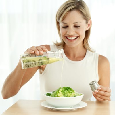 George Doyle/Stockbyte/Getty Images Try drizzling flax oil on your salad instead of olive oil.