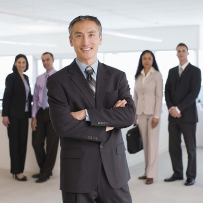 Jupiterimages/Creatas/Getty Images Executive resumes incorporate headlines and branding to stand out.