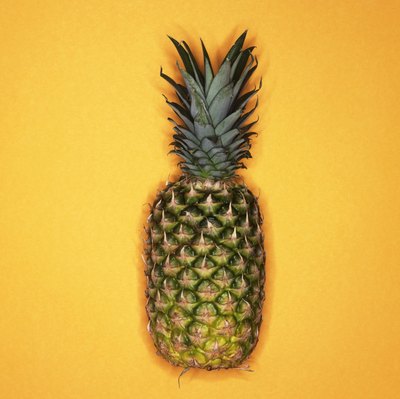 Burke/Triolo Productions/Brand X Pictures/Getty Images Eat pineapple with your grilled chicken for healthy digestion.