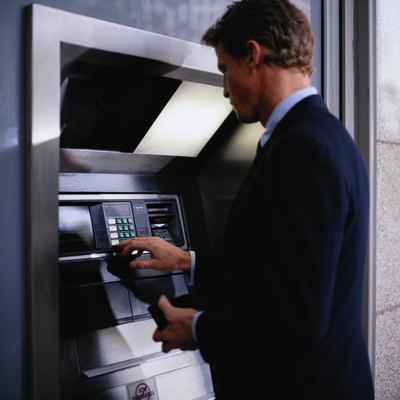Keith Brofsky/Photodisc/Getty Images Withdrawal limits help protect customers.