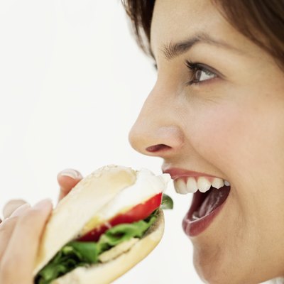 Stockbyte/Stockbyte/Getty Images Your body has specific ways of digesting carbs, proteins and fats.