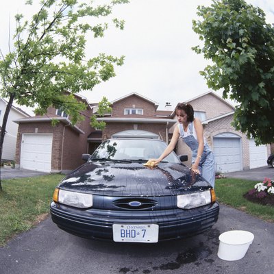Hemera Technologies/Photos.com/Getty Images Many people take a mortgage to make personal purchases such as automobiles.