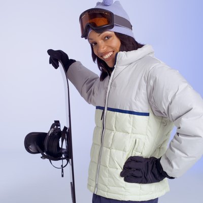 Jupiterimages/liquidlibrary/Getty Images Menstruation may raise your risk of injury while snowboarding.
