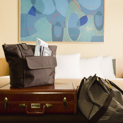 Jupiterimages/Comstock/Getty Images Overnight lodging is one of your deductions for business travel.