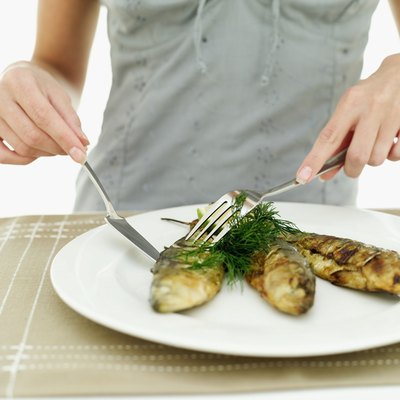 Stockbyte/Stockbyte/Getty Images Add more heart-healthy fish to your diet.