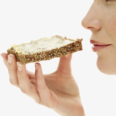 Stockbyte/Stockbyte/Getty Images Both wheat and rye bread are low in calories and high in fiber.