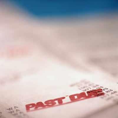 Ryan McVay/Photodisc/Getty Images Any collection activity can lower your credit score.