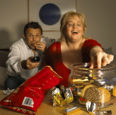 BananaStock/BananaStock/Getty Images Your weight and the types of foods you eat affect your blood levels of triglycerides and LDL cholesterol.