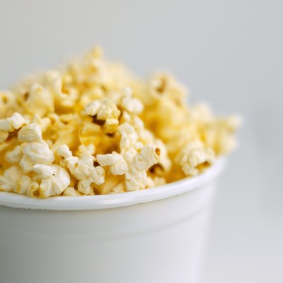 Ciaran Griffin/Stockbyte/Getty Images Air-popped popcorn is a good high-fiber snack.