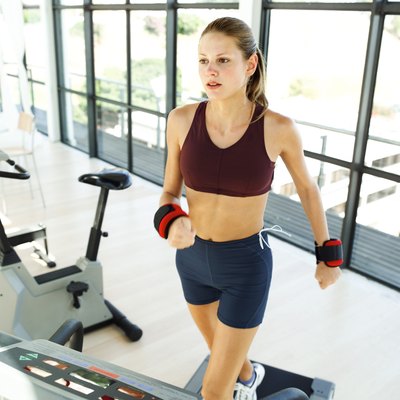 George Doyle/Stockbyte/Getty Images Walking with wrist weights will build upper-body strength and muscles.