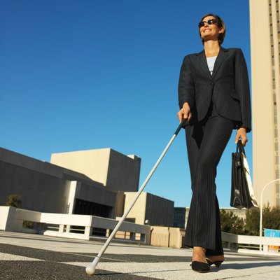 George Doyle/Stockbyte/Getty Images Some minor adjustments may allow you to keep your job if you become blind.