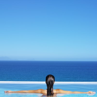 George Doyle/Stockbyte/Getty Images To increase strength, lengthen your limbs as they move through the water.