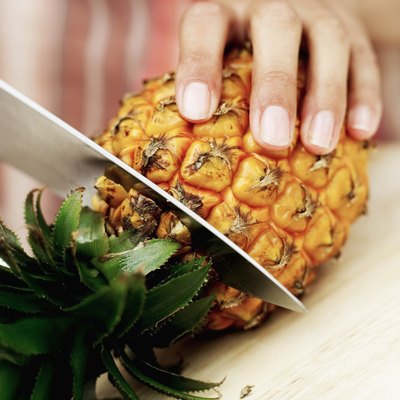 Stockbyte/Stockbyte/Getty Images Most of the fiber in pineapple is the insoluble type.