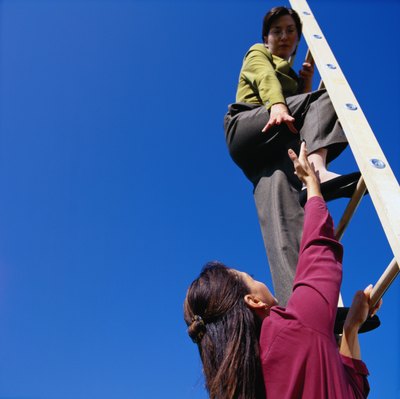 Duncan Smith/Photodisc/Getty Images Make a plan to climb the corporate ladder.