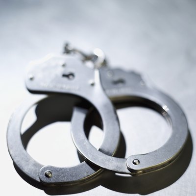 Stockbyte/Stockbyte/Getty Images Some states protect workers from being fired over pending charges.