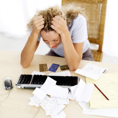 George Doyle/Stockbyte/Getty Images Credit card bills increase your debt-to-income ratio.