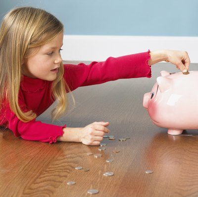 Brand X Pictures/Brand X Pictures/Getty Images Instead of a piggy bank, have kids put money into a savings account.