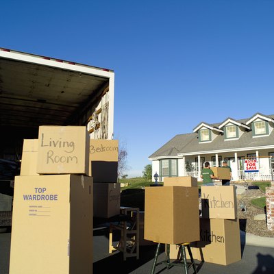 Brand X Pictures/Brand X Pictures/Getty Images Hiring movers saves your back but hurts your wallet.