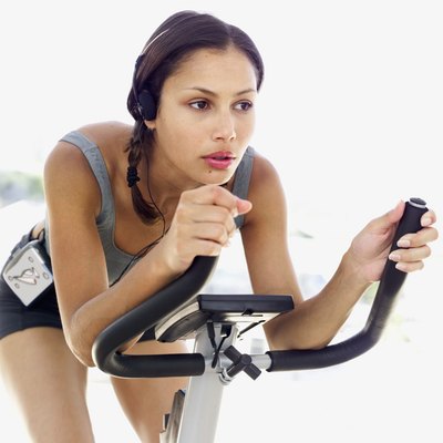 Stockbyte/Stockbyte/Getty Images Indoor cycling provides an incredible leg-strengthening workout.
