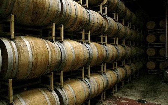 Some wine varieties age in oak barrels, while others ferment in large stainless steel tanks.