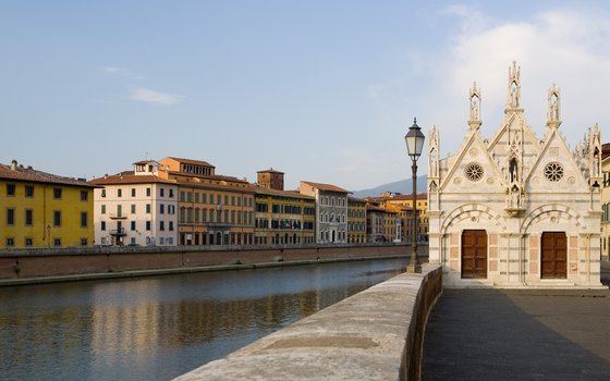 A guided tour of Pisa can include a boat ride on the Arno River.
